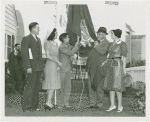 Typical American Family - Williams family raising Oklahoma flag with Harvey Gibson