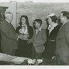 Typical American Family - Williams family children receiving signed baseball and bracelet from Harvey Gibson