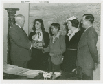 Typical American Family - Williams family children receiving signed baseball and bracelet from Harvey Gibson
