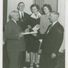 Typical American Family - Westbrook family receiving key and lease from Harvey Gibson
