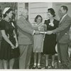 Typical American Family - Ward family receiving key and lease from Harvey Gibson