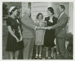 Typical American Family - Ward family receiving key and lease from Harvey Gibson