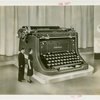 Underwood Elliott Fisher Co. - Man and woman posing with giant typewriter
