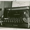 Underwood Elliott Fisher Co. - Two women posing with giant typewriter