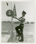 United States - Army - Marine hangs sign