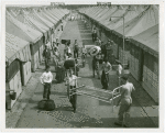 United States - Army - Soldiers moving beds from tents