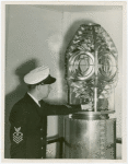United States - Coast Guard - Guardsman adjusting lamp in lighthouse