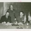 Venezuela Participation - Grover Whalen and Ernesto López (Commissioner General) signing contracts