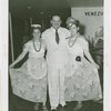 Venezuela Participation - Ernesto López (Commissioner General) and two women in traditional dress
