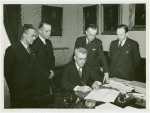Vermont Participation - George Aiken (Governor) signing bill as officials look on