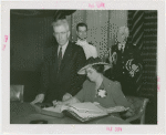 Vermont Participation - Mrs. Aiken (Governor's wife) signing guestbook