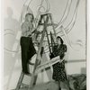 Thyra Samta Winslow and man on ladder painting