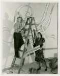 Thyra Samta Winslow and man on ladder painting