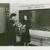 Washington (State) Participation - Women at exhibit with Washington apples