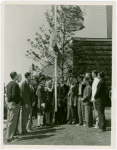 Washington (State) Participation - Group raising Washington flag outside building