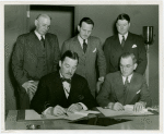 West Virginia Participation - Grover Whalen and officials signing contracts