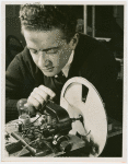 Westinghouse - Man working on motor of light bulb
