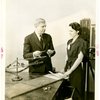 Westinghouse - Man and woman examining vapor lamp