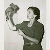 Westinghouse - Woman holding hat