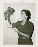 Westinghouse - Woman holding hat