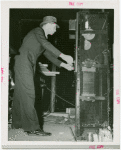 Westinghouse - Man examining machine