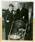 Westinghouse - Time Capsule - Clark Wissler pouring solution over time capsule while man watches