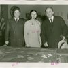 Yugoslavia Participation - Constantin Fotich (Ambassador) looking at Fair model with man and woman