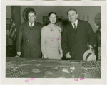 Yugoslavia Participation - Constantin Fotich (Ambassador) looking at Fair model with man and woman