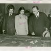 Yugoslavia Participation - Constantin Fotich (Ambassador) looking at Fair model with man and woman