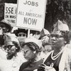 Women with sign "Freedom and Jobs for All Americans Now"