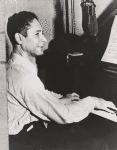 Jellyroll" Morton playing the piano.