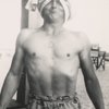 Jack Kerouac with a sheet draped over his head