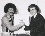 Miguel Pinero and Joseph Papp holding an award won for Short Eyes