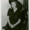 Dresses-Model poses in chair