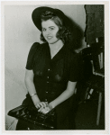 Dresses-Model poses in chair