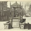 Double-troughed well in plaza with monument in background