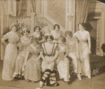 Julian Eltinge (seated, center) and cast in the stage production The Fascinating Widow.