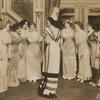 Julian Eltinge (center with back to camera) and cast in the stage production The Fascinating Widow.