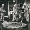 Dorian Harewood (sitting) and unidentified cast members in the stage production Streamers