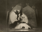 Scene from Die glückliche Hand with character on steps
