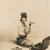 Doris Humphrey in oriental costume holding a cigar.