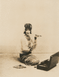 Doris Humphrey in oriental costume holding a cigar.