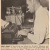 Author Richard Wright sitting at typewriter and listening through an Ediphone to create a draft of his autobiography "Black Boy."