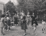 J.D. Cannon and Colleen Dewhurst with children and others in park during production of Taming of the Shrew