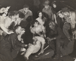 Scene from the American Negro Theatre's production of "Natural Man," featuring (from left to right top row) Alice Childress, Tish O'Toole, Vivian Hall-Dogan, Berry Haynes, Maxwell Glanville, Claire Leyba, George Lewis, Milford Meekins, Howard Augusta, and William Lopez Daniels. (Bottom row) James Jackson, Lulu Hairston, Ruby Dee, Stanley Greene (on floor), and Kenneth Manigault