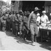 African-American soldiers on a soup line, at the YMCA'.