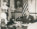 Congressman Sol Bloom, Representative from New York and Associate Director United States George Washington Bicentennial Commission seated at his desk at the Commission Headquarters, Washington D.C.