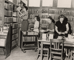 Rearranging books in Port Richmond Library