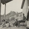 Frederick V. Field, and three others seated on a porch