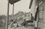 Frederick V. Field, and three others seated on a porch